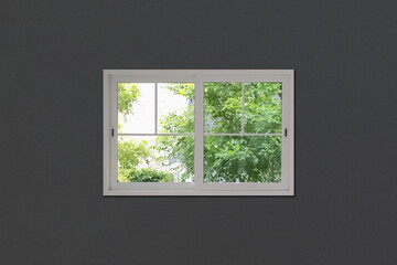 White pvc window on dark wall with beautiful summer view of green trees outside for real estate business presentation background.