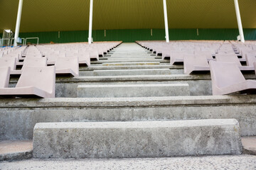 Empty steps amidst seats at stadium