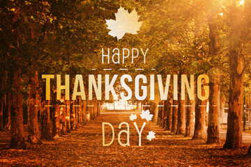 Happy Thanksgiving Day text against trees