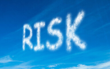 Naklejka na ściany i meble Risk written in white in sky