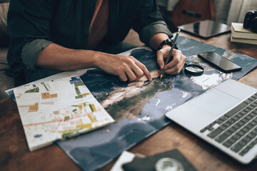 Fototapeta premium Travelers planning trips and finger pointing on map, or find travel routes. Travel concept.