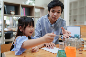 Kid and teacher doing science experiments. back to school concept