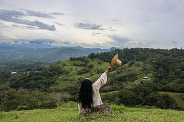 woman grabbing a straw hat 
