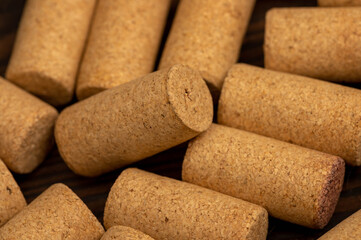 Wine corks scattered on a wooden background. Close-up, selective focus