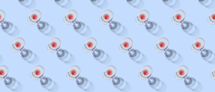 Many wineglasses on light blue background, top view. Pattern for design