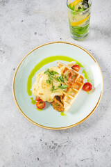 belgian waffle with bacon and cherry tomatoes