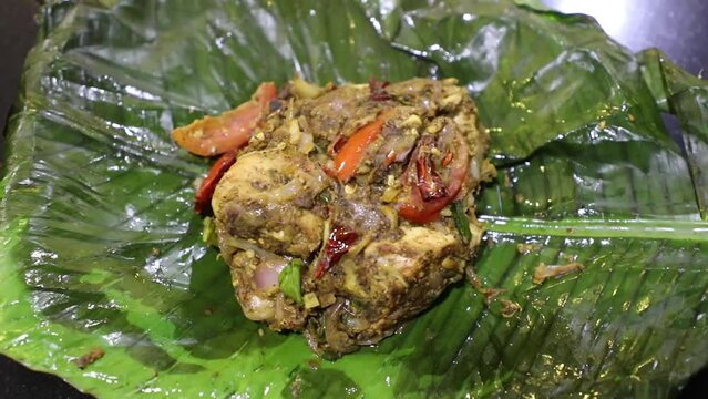 Chicken Pollichathu with banana leaf Top view full HD Footage