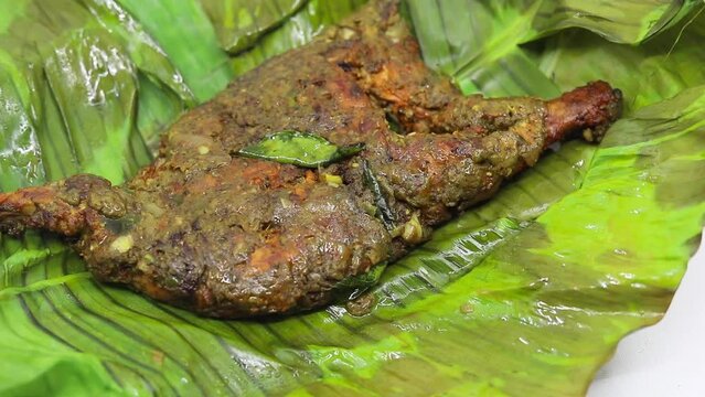 Pothi BBQ kerala style. Barbecue with Banana leaf on white background Full HD footage