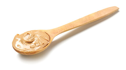 Wooden spoon with tasty nut butter on white background
