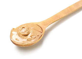 Wooden spoon with tasty nut butter on white background, closeup
