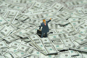 Miniature people figure toys photography. Inflation and recession concept. Businessmen standing...