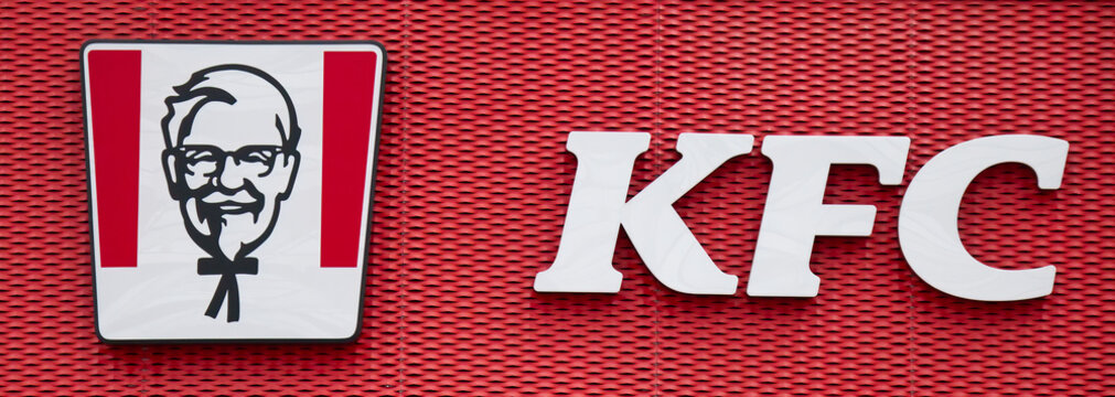 Bologna, Casalecchio - Italy - September 3, 2022: KFC (Kentucky Fried Chicken) logo on a facade