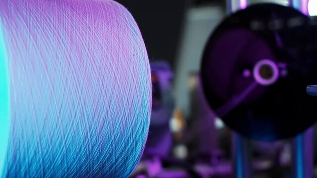 Industrial textile factory. Coils with threads in production. close up, slow motion. 4K