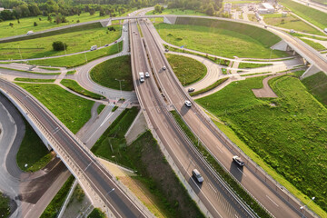 Aerial view of cars driving on round intersection in city, Transportation roundabout infrastructure, Highway road junction in Wroclaw, Poland