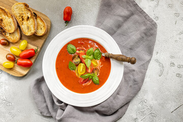 Tomato soup with fresh, crunchy vegetables and herbs. Served cold with hot bread. Spanish gazpacho recipe.