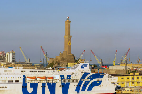 GENOA, ITALY - MAY 19, 2018:  Grandi Navi Veloci  (GNV) ferry infront of the Lighthouse of Genoa (faro di Genova)