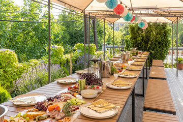 Food served outdoor on a long table