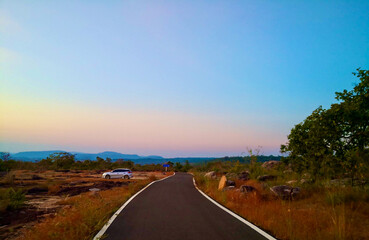 Empty asphalt road, going into Pha Team National Park, Thailand.