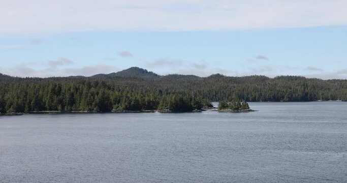 Cruise pine forest shore inside passage islan. The Inside Passage a coastal route for ships and boats. Network of natural island channels weave through the Pacific Northwest coast of the North America