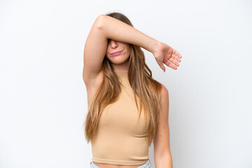 Fototapeta premium Young caucasian woman isolated on white background covering eyes by hands