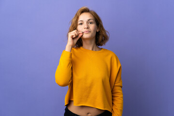 Young Georgian woman isolated on purple background showing a sign of silence gesture