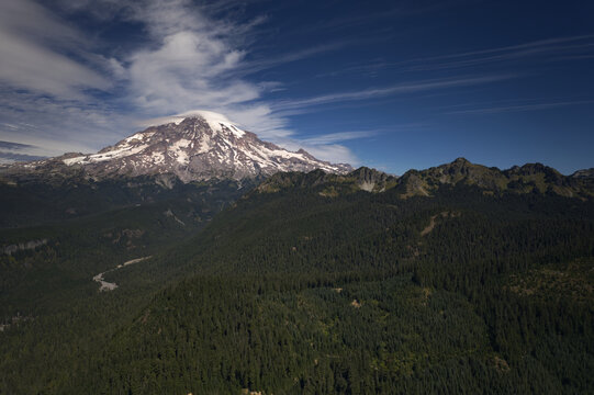 View of Mt. Rainier covered with snow on a sunny morning seen from above Gifford Pinchot National Forest in Washington State.