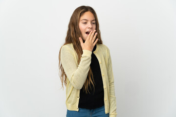 Little girl over isolated white background yawning and covering wide open mouth with hand