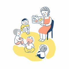 絵本の読み聞かせをする保育士と子供たち