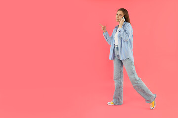 Fototapeta premium Concept of people, young woman on pink background