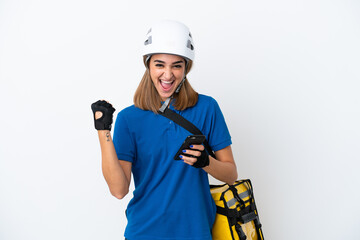 Young caucasian woman with thermal backpack isolated on white background with phone in victory position