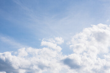 Naklejka na ściany i meble Summer clouds in the blue sky. Cloudscape. Beautiful background.