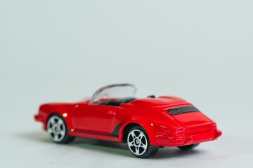 isolated red sporty cabriolet toy car