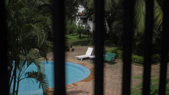 Cinematic Poolside Seating Area In Goa