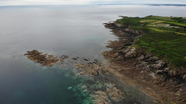 Coastline with promontory Pointe du Raz and rocky beach in Crozon peninsula, Brittany, France.