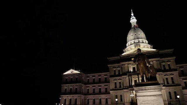 Michigan State Capitol building in Lansing, Michigan at night with video panning left to right.