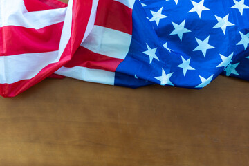 America flag waving pattern on wooden background in table top view