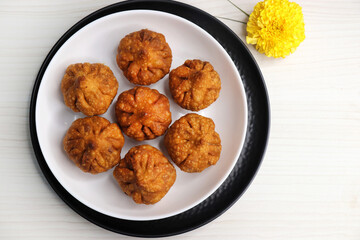 Fried Modak. It's a traditional sweet dish of coconut, jaggery, and dry fruits stuffed inside the...