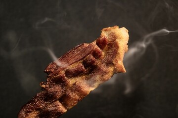 Close up bacon with smoke
