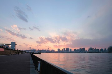 Low-angle view of Rainbow Bridge above the water in Tokyo, Japan