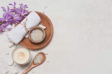 Spa composition with white  orchid and spa set on grey background