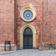 Fototapeta premium Entrance of Riddarholmen Church, located in the island of Riddarholmshamnen, old city, Gamla stan. before sunset in a summer day, Stockholm, Sweden