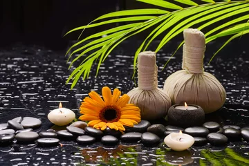 Tuinposter Lifestyle and Healthy Concept. Spa setting for massage treatment on black background © Mee Ting