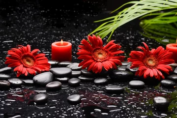 Foto op Plexiglas still life of with  sunflower,candle  and zen black stones ,wet background  © Mee Ting