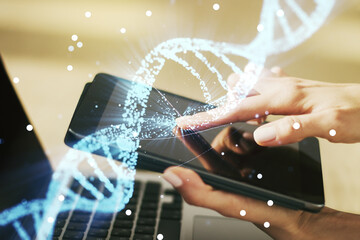 Creative concept with DNA symbol illustration and finger clicks on a digital tablet on background....