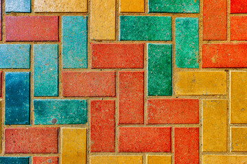 Pavement. Sidewalk tiles background. Pavement tiles. Top view. Closeup. Footpath. Bright tone sidewalk tiles. Colorful sidewalk tiles © Lucky Photographer