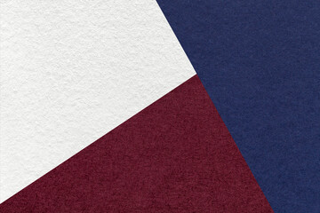 Texture of craft navy blue, white and dark wine shade color paper background. Vintage abstract...