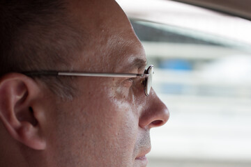 portrait of a man driving a car close-up