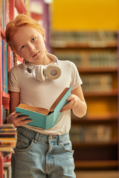 Girl Choosing A Book