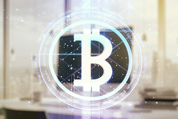 Double exposure of creative Bitcoin symbol hologram with computer on background. Mining and blockchain concept