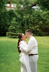 Cute newlyweds kissing in the park